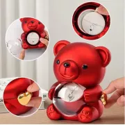 Скринька-ведмідь, що обертається, з трояндою в колбі